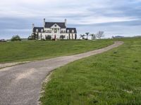 an image of a farm house and walkway in the country side view, just in the middle of the day