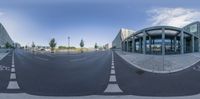 three streets in an office area with an empty road in front of the building at the bottom