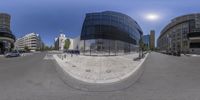 this 360 - view is a high definition picture taken at an intersection with cars and pedestrians