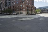 a fire hydrant sitting on top of a sidewalk next to tall buildings on a sunny day