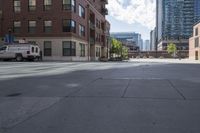 a fire hydrant sitting on top of a sidewalk next to tall buildings on a sunny day