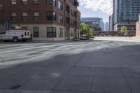 a fire hydrant sitting on top of a sidewalk next to tall buildings on a sunny day