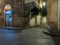 street with closed doors and an empty alley in the foreground of the image,