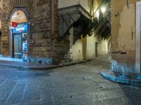 street with closed doors and an empty alley in the foreground of the image,