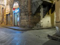 street with closed doors and an empty alley in the foreground of the image,