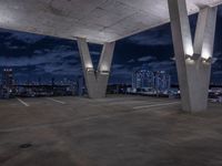 a empty parking garage filled with white lights under some dark clouds at night - time