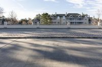 the skateboarder is on the side walk by himself on the sidewalk and in the street