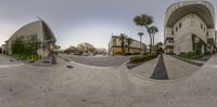 this is a photo of a fish eye view looking at some buildings from a skateboard park