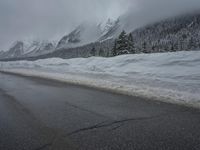 Foggy Day in the Highlands: Road and Snow-Capped Mountains