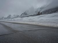 Foggy Day in the Highlands: Road and Snow-Capped Mountains