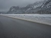 Foggy Day in the Highlands: Road and Snow-Capped Mountains