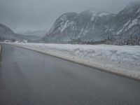 Foggy Day in the Highlands: Road and Snow-Capped Mountains