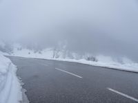 there are a lot of snow on the road thats almost covered in snowballs