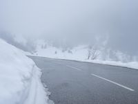 there are a lot of snow on the road thats almost covered in snowballs