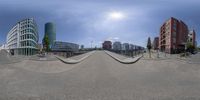 the 360 - ball shot is of the city street and buildings with a big circle on the ground