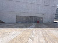 an empty room with a red suitcase in it on the ground in front of a garage
