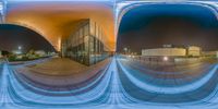 an image of the reflection in front of a building at night with multiple circles of lines