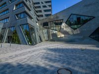 the entrance of the building has triangles that are shaped like intersecting, one at which appears to be being very interesting