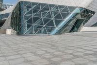 an image of a building that is designed to look like a pyramid with a giant window in it