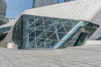 an image of a building that is designed to look like a pyramid with a giant window in it