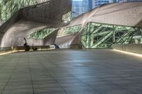 an abstract image of an outside building with large windows and floor to ceiling lighting of a modern architecture