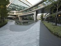 there is a curved, modern building along the sidewalk in the city area that looks like it has been designed to mimic traffic and landscape