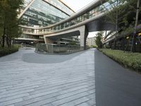 there is a curved, modern building along the sidewalk in the city area that looks like it has been designed to mimic traffic and landscape