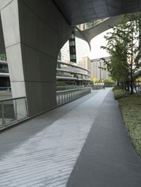 there is a curved, modern building along the sidewalk in the city area that looks like it has been designed to mimic traffic and landscape