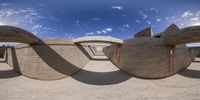 an upside down perspective picture of some modern architecture on the beach - looking like it would have been filmed