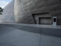 Futuristic Building on a Concrete Street