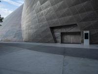 Futuristic Building on a Concrete Street