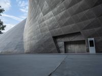 Futuristic Building on a Concrete Street