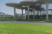 an image of a large building in the middle of nowhere with multiple arches in it