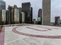 a red circle with an email on the center sits in front of city highrise buildings