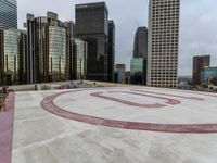 a red circle with an email on the center sits in front of city highrise buildings