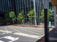 a photo of an empty city street with buildings and a traffic light in the background