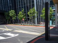 a photo of an empty city street with buildings and a traffic light in the background