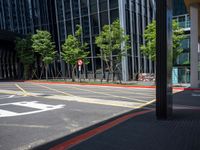 a photo of an empty city street with buildings and a traffic light in the background