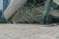 an empty building with many windows that look like a triangle structure with a staircase going up it