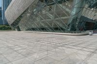 an empty building with many windows that look like a triangle structure with a staircase going up it