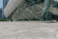 an empty building with many windows that look like a triangle structure with a staircase going up it