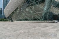 an empty building with many windows that look like a triangle structure with a staircase going up it