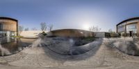 an outside hot springs near a building and hot springs around it with water coming out