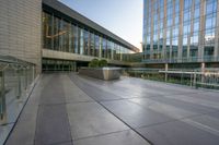 there is a bench on this floor outside a building in this picture that appears to be empty