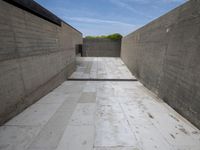 the concrete walls and walkway of a modern building have been built in order to keep them from falling