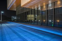 Futuristic Office Building in Shanghai: Neon Lights at Night