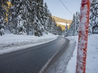 German Alps Winter Morning: A Road Through Snowy Mountains