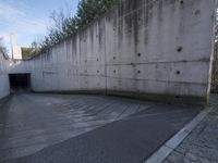 this is an image of a city tunnel at the end of the street and someone walking down to the exit