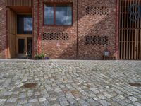 German Brick Wall and Cobblestone Road