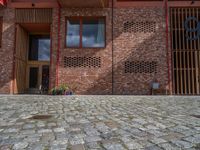 German Brick Wall and Cobblestone Road